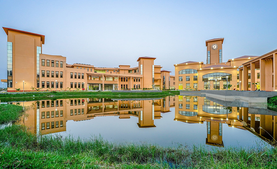 Academic building at Biswa Bangla Biswabidyalay reflected in a water body